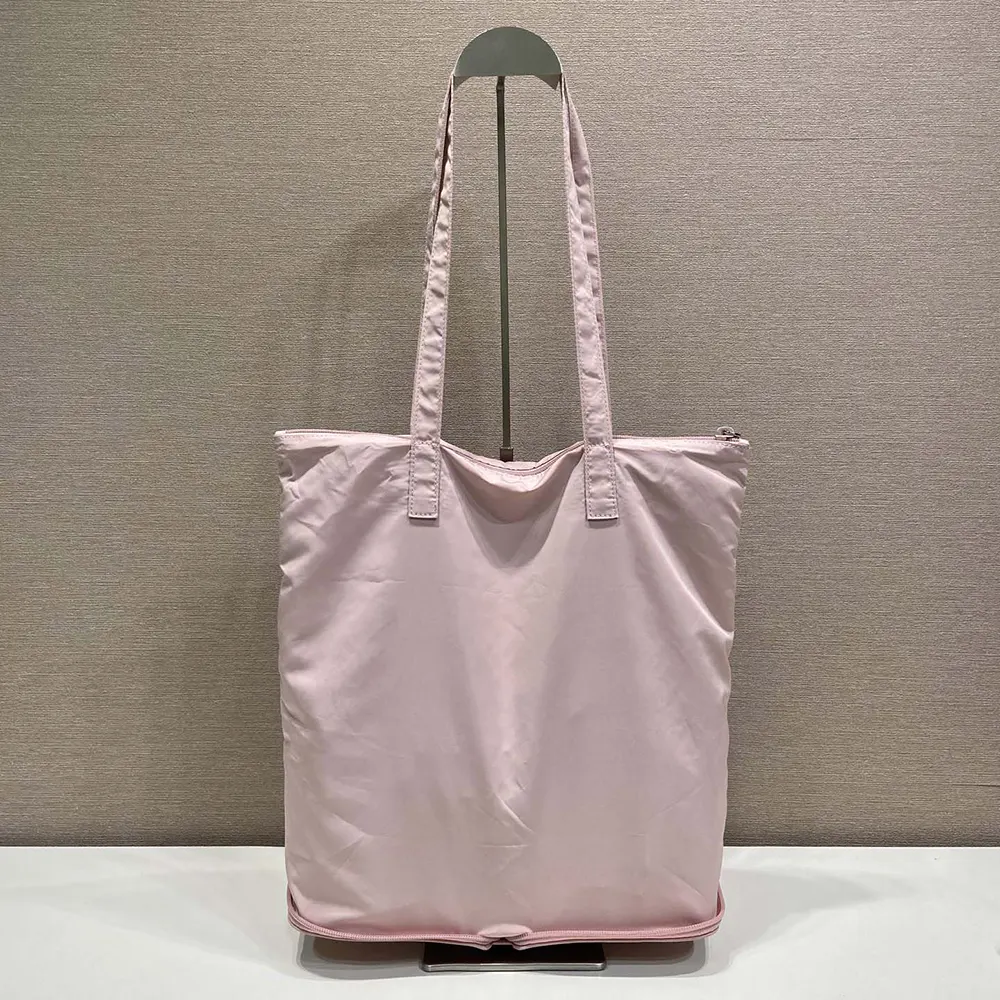 Prada Women Saffiano Leather Pendant With Re-Nylon Tote Bag-Peach 1TT330